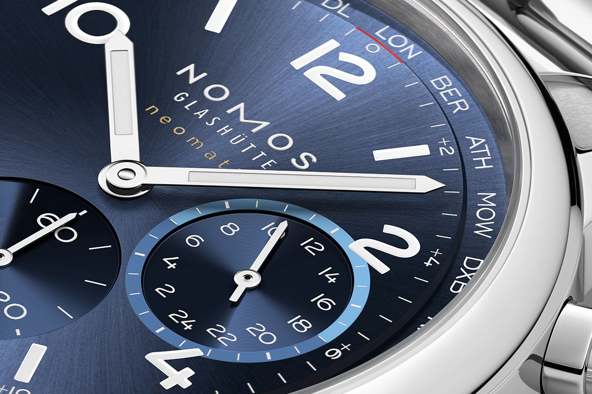 A detail of the dial on the Nomos Club Sport neomatik Worldtimer